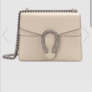 Gucci dinoysus mini leather bag.